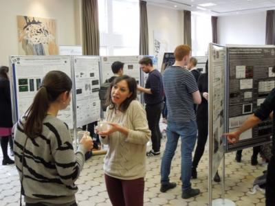People attending neuroscience day in a poster session