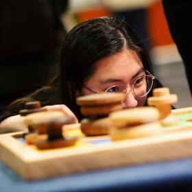 A participant looking at a model