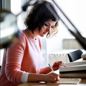 Photograph of a student writing an application